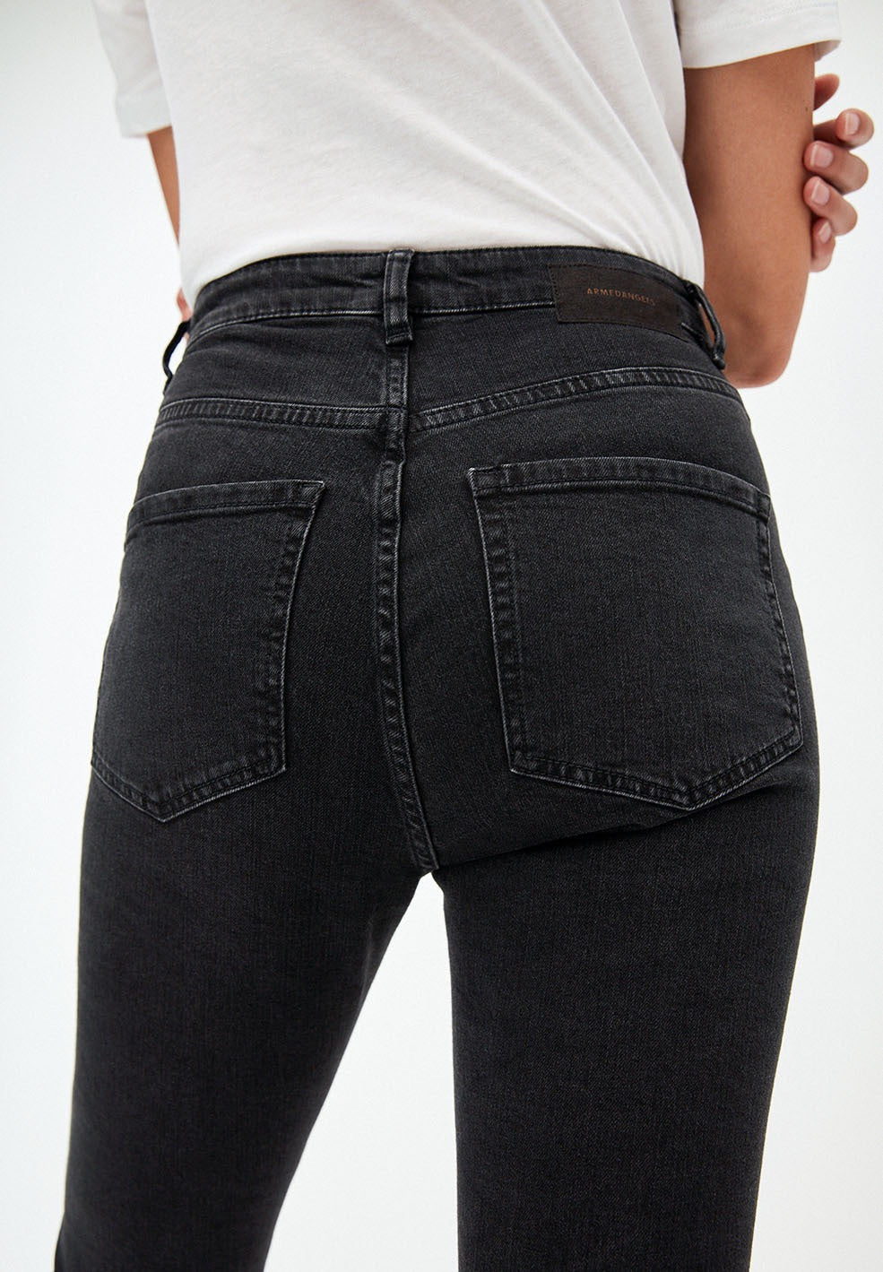 Skinny jeans from Armedangels. Full length slim leg, zipper closure , side and back pockets. Made from sustainable organic cotton with a little bit of elastane for extra comfort. In a washed down black colour.