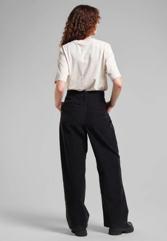 Vickleby wide leg corduroy trousers from Dedicated sustainably made from organic cotton. With a zipper closure, a high waist and side pockets. In black.