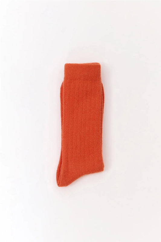 Orange wool blend socks from the Spanish brand Suite13Lab. Made from 70% merino wool, 27% polyamide, 3% elastomer. Made in Spain.