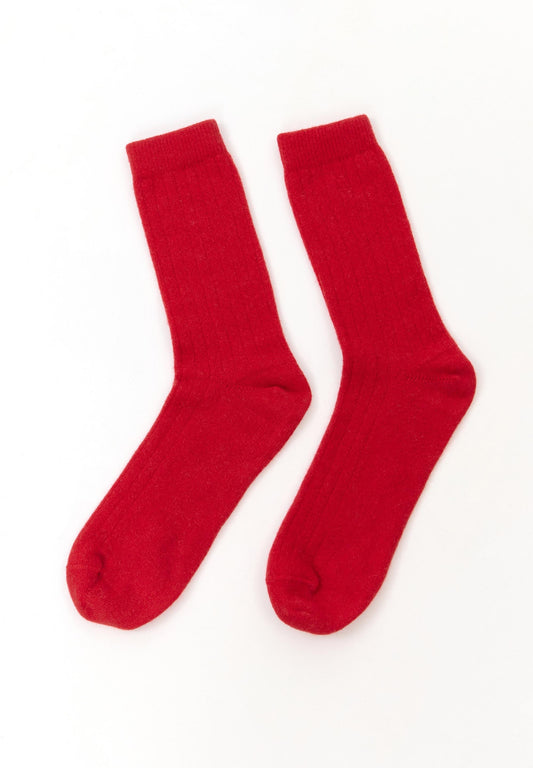 Bright red wool blend socks from the Spanish brand Suite13Lab. Made from 70% merino wool, 27% polyamide, 3% elastomer. Made in Spain.