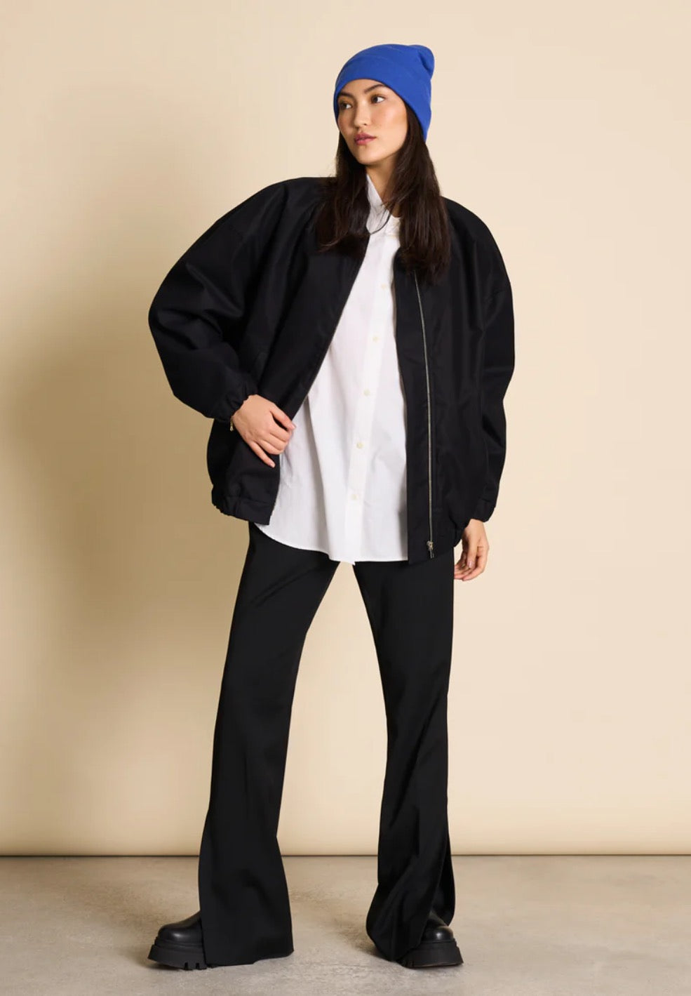 Bomber jacket by Jan n June. Oversized unisex fit. Long sleeves, bomber collar and zipper closure. Lined. Made from sustainable organic cotton. In black.
