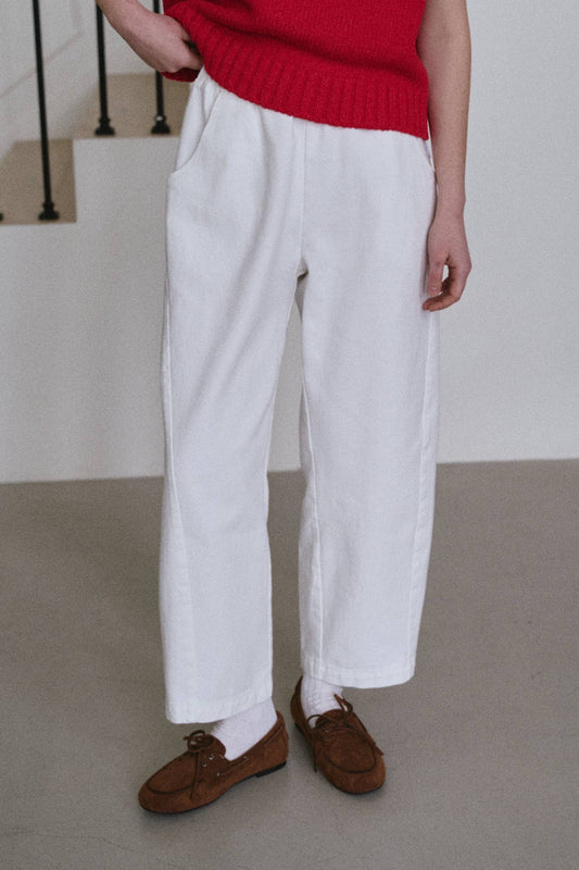 Arc Pants by Le Bon Shoppe. Barrel leg trousers made from cotton canvas, with deep side pockets and an elastic waistband. The colour is white.