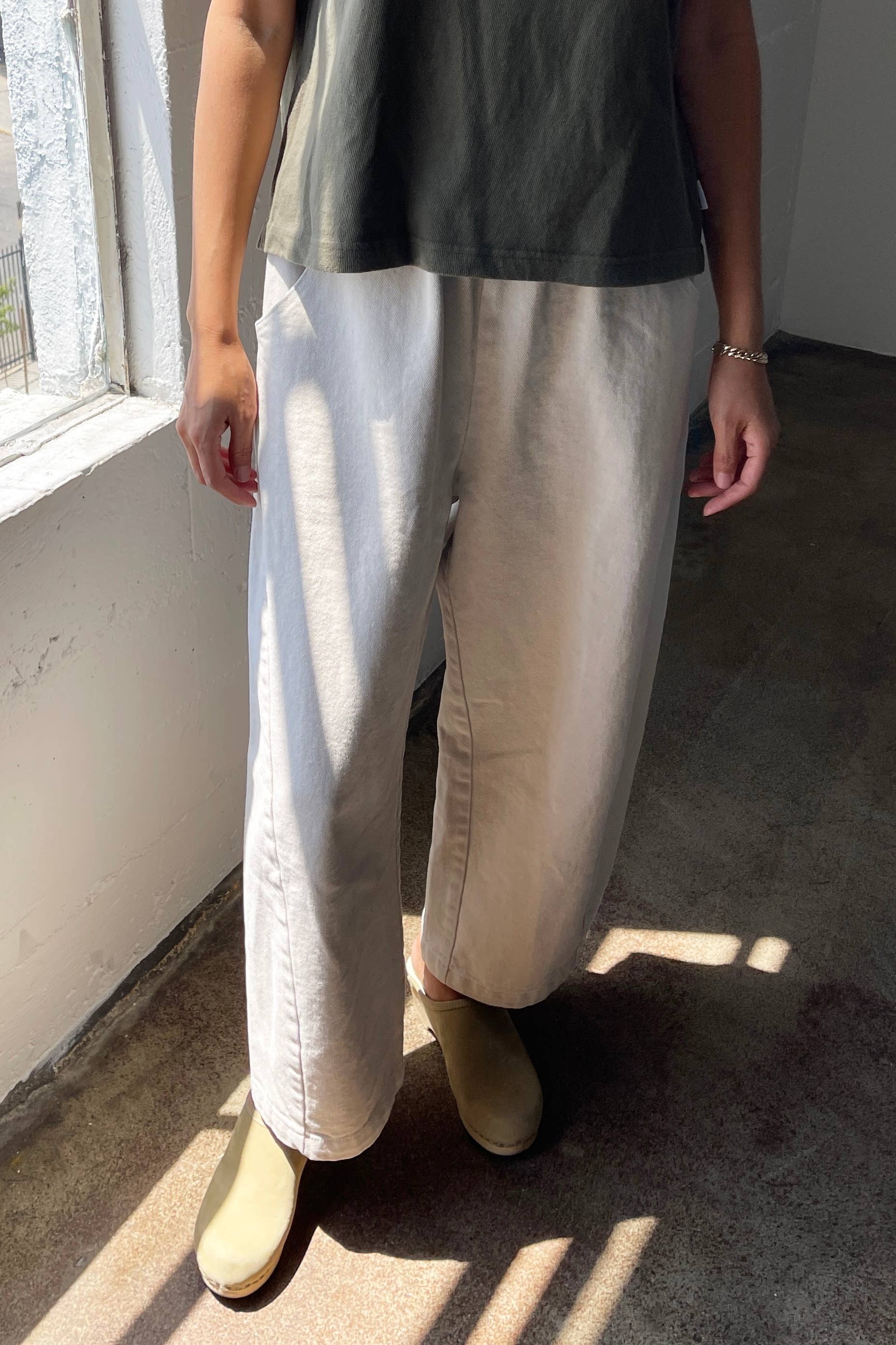 Barrel leg Arc pants from Le Bon Shoppe. Slightly cropped wide leg, elastic waistband, deep pockets. Undyed cotton canvas, creamy off white colour.
