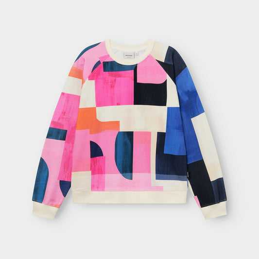 Colorful geometric-patterned sweatshirt on a light gray background