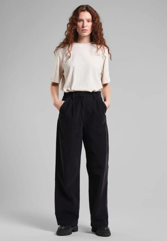 Vickleby wide leg corduroy trousers from Dedicated sustainably made from organic cotton. With a zipper closure, a high waist and side pockets. In black.