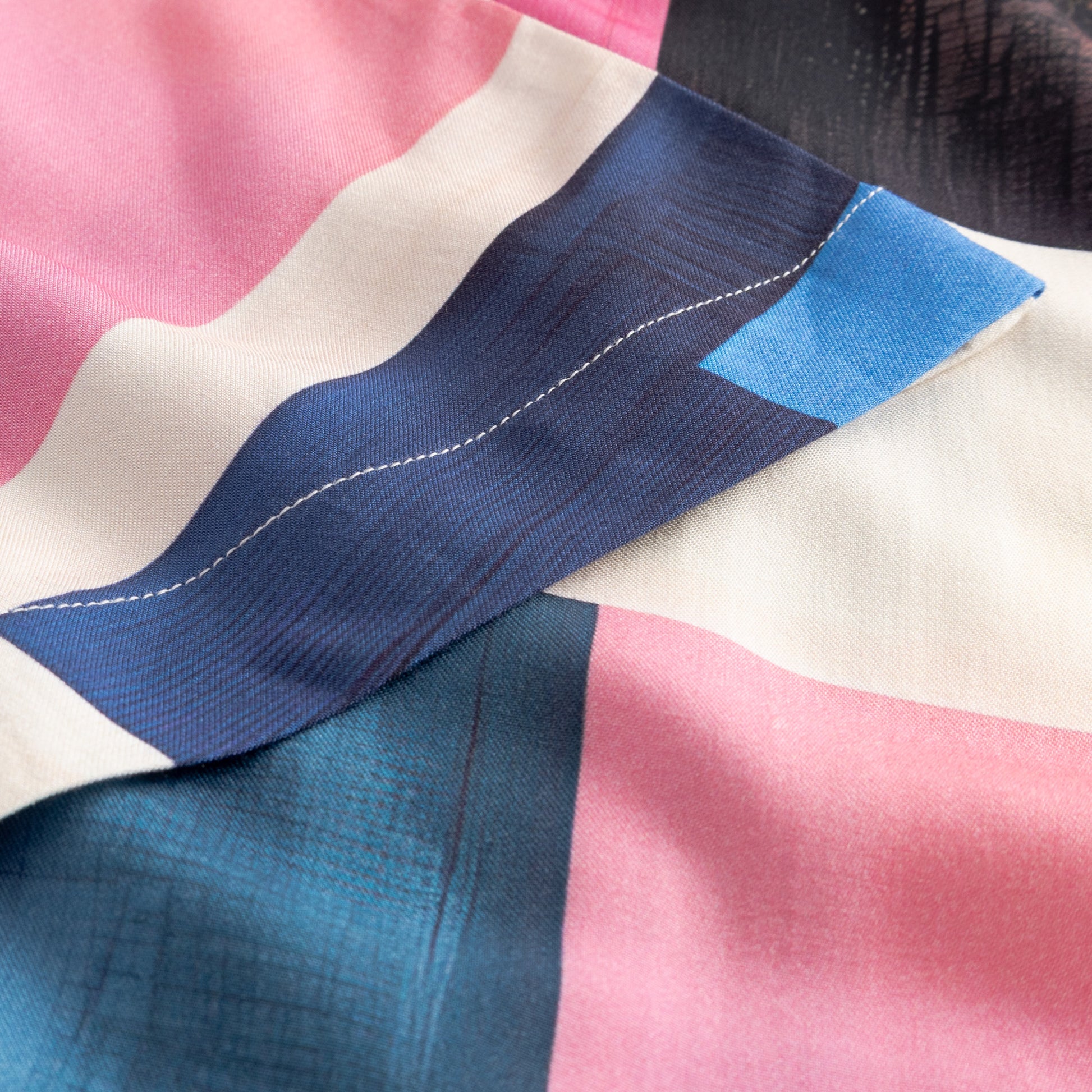 Close-up of fabric with blue and pink pattern