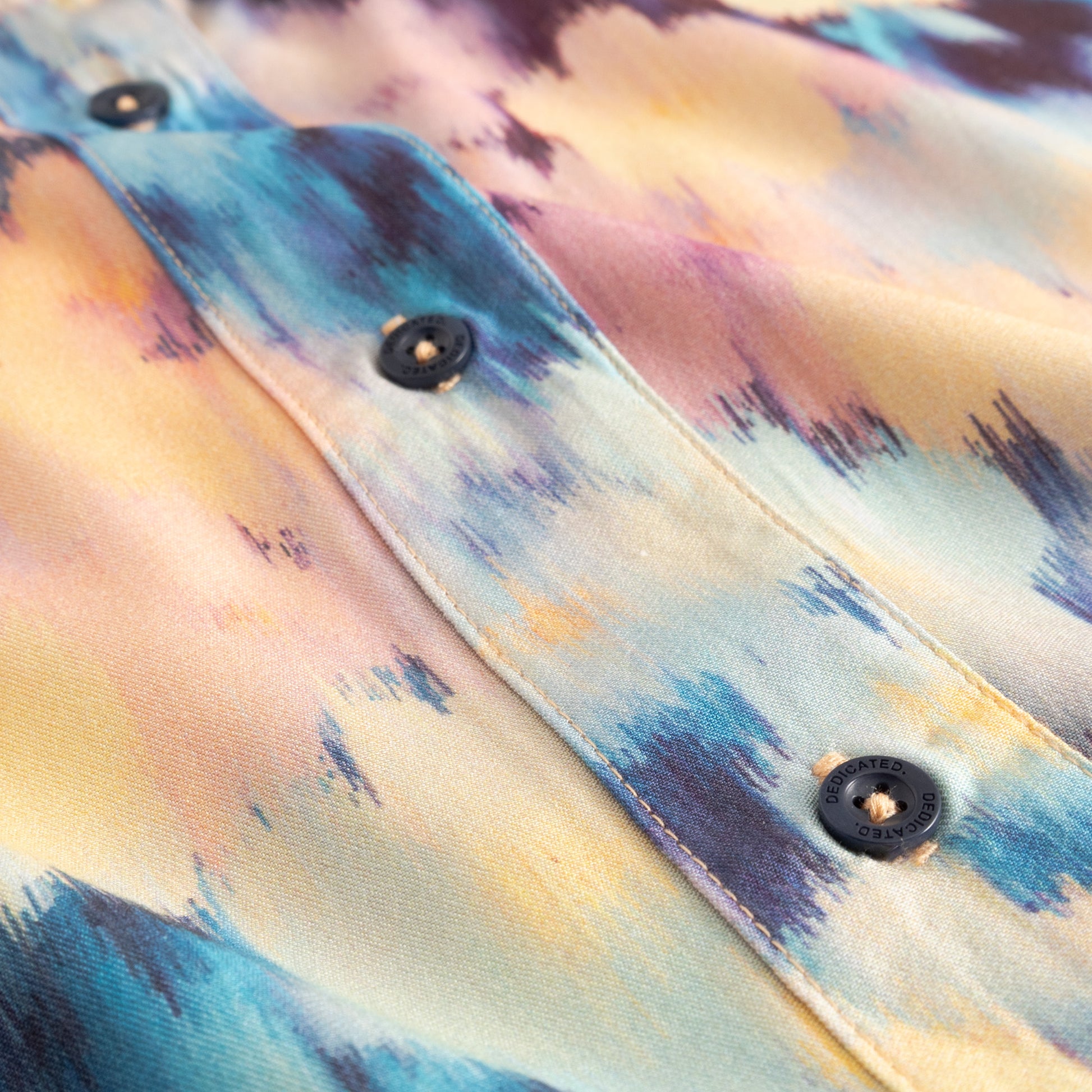 Close-up of a colorful shirt with button details