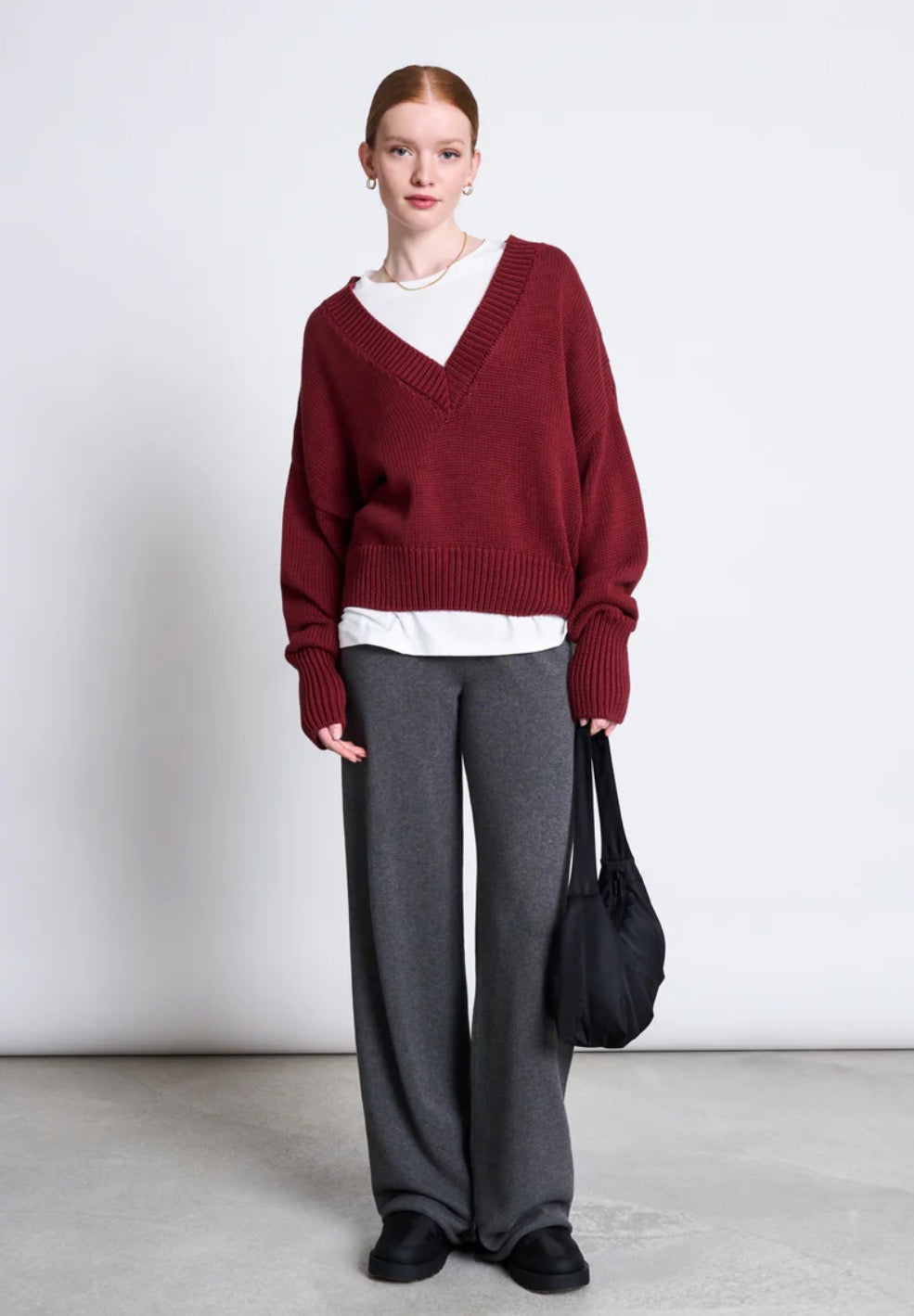 Oversized v-neck jumper from Jan n June. Slightly cropped, long sleeves. Made from sustainable organic cotton. In wine red.