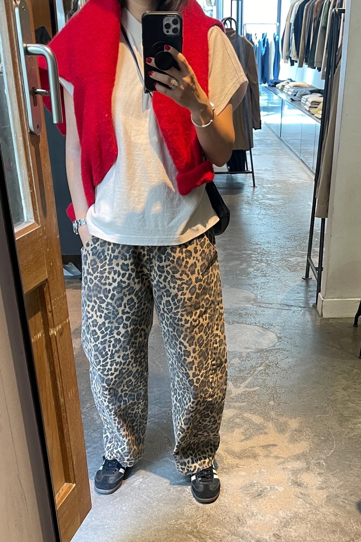 Arc Pants from Le Bon Shoppe. Barrel leg jeans with an elastic high waist and a slightly curved, cropped leg. Made from pure cotton canvas with a leopard print. With deep side pockets.