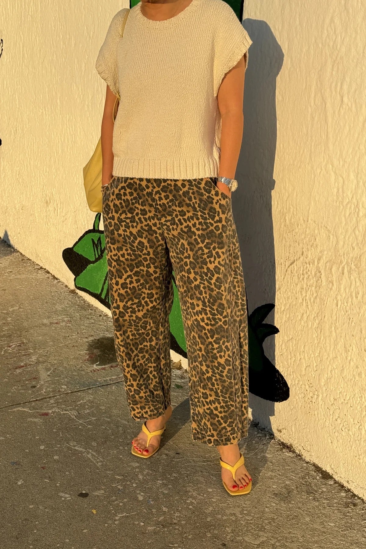 Arc Pants from Le Bon Shoppe. Barrel leg jeans with an elastic high waist and a slightly curved, cropped leg. Made from pure cotton canvas with a leopard print. With deep side pockets.