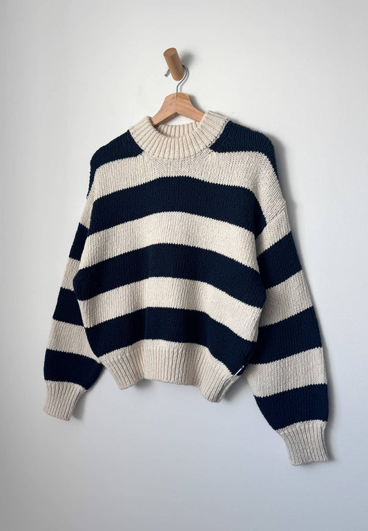 Crew neck knitted jumper from Le Bon Shoppe, made from pure cotton. Long sleeves, ribbed hem and sleeves, wide horizontal stripes in dark navy and off white.