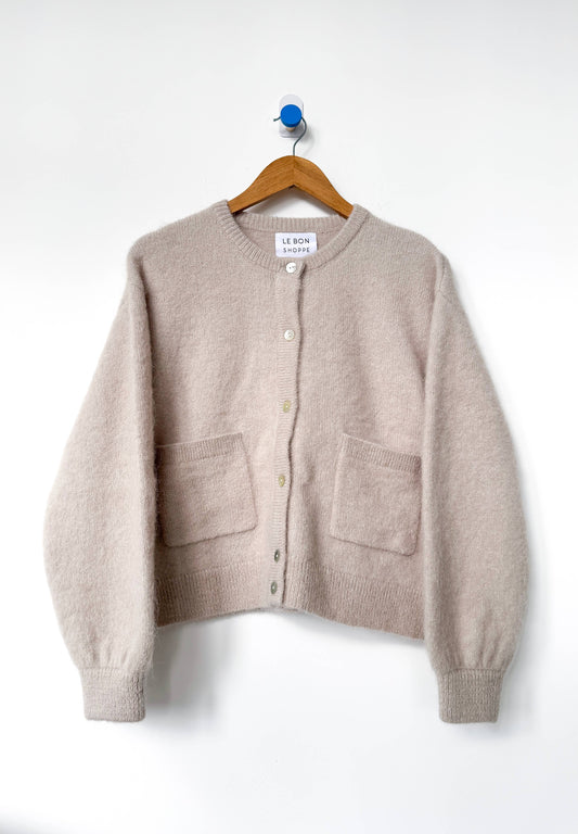 Beige Amelie cardigan from Le Bon Shoppe  on a hanger against a white background